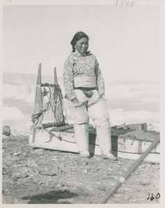 Image: Eskimo [Inuk] Girl at Cape York beside sledge [Nujardlak Petersen]